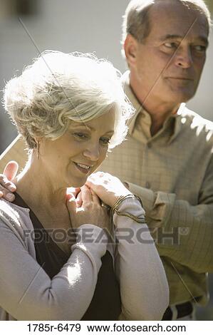 Stock Photo - Close-up of a mature couple in thoughtful mood. Fotosearch