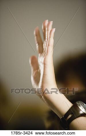 Picture - Close-up of a raised hand. Fotosearch