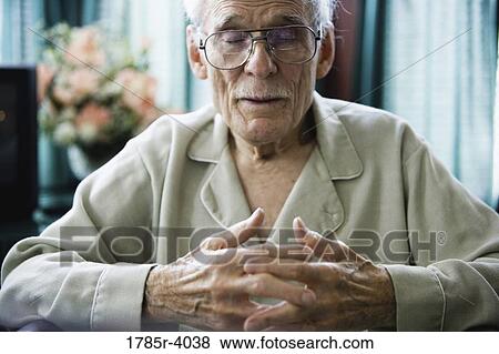 Close-up of a senior man dozing off View Large Photo Image Stock Photo - Close-up of a senior man dozing off. Fotosearch