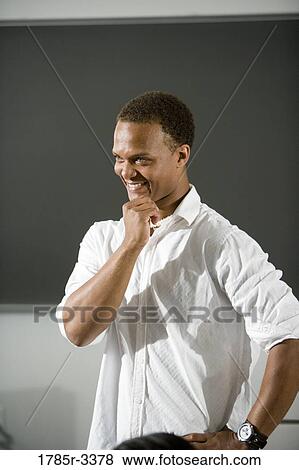 Close-up of a teacher in a classroom View Large Photo Image Stock Photo - Close-up of a teacher in a classroom. Fotosearch