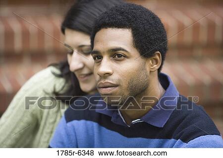 Close-up of a young inter-racial couple View Large Photo Image Stock Photo - Close-up of a young inter-racial couple. Fotosearch