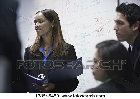 Stock Image - Close-up of business people in a meeting. Fotosearch