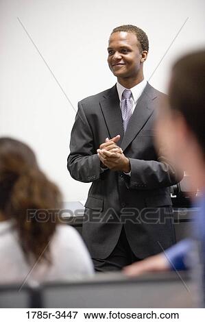 Stock Photo - Close-up of businessman in meeting. Fotosearch