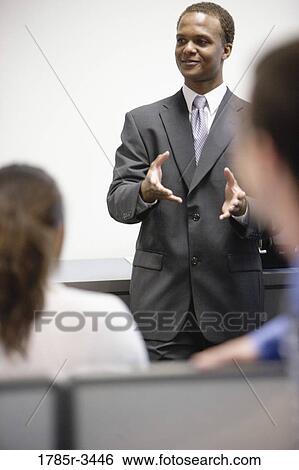 Close-up of businessman in meeting View Large Photo Image Stock Photograph - Close-up of businessman in meeting. Fotosearch