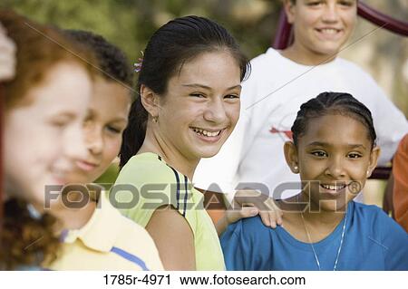 Stock Image - Close-up of children smiling. Fotosearch