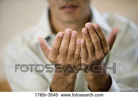 Close-up of cupped hands View Large Photo Image Stock Photography - Close-up of cupped hands. Fotosearch
