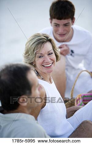 Close up of family on the beach View Large Photo Image Stock Photography - Close up of family on the beach. Fotosearch
