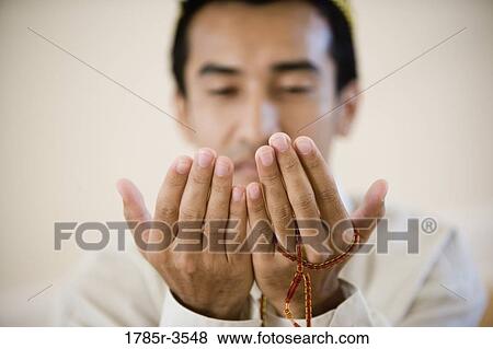 Close-up of hands praying View Large Photo Image Stock Photo - Close-up of hands praying. Fotosearch