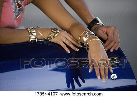 Close up of hip-hop couple's jewelry and bling View Large Photo Image Stock Photo - Close up of hip-hop couple's jewelry and bling. Fotosearch