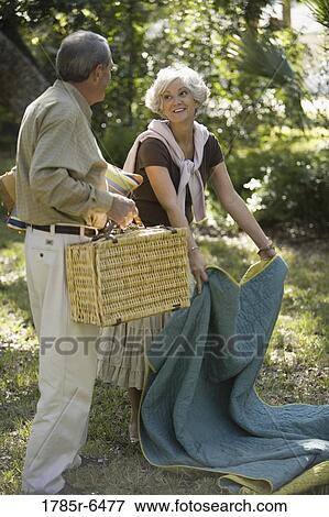 Close up of mature couple going on a picnic View Large Photo Image Stock Photo - Close up of mature couple going on a picnic. Fotosearch