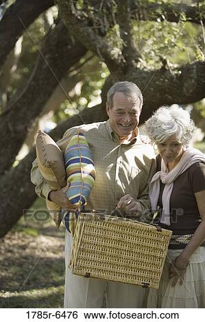 Close up of mature couple going on a picnic View Large Photo Image Stock Photograph - Close up of mature couple going on a picnic. Fotosearch
