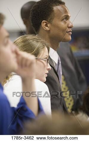 Close up of office colleagues standing View Large Photo Image Stock Image - Close up of office colleagues standing. Fotosearch