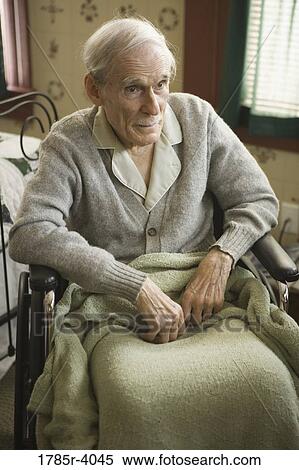Close-up of senior man sitting on wheelchair View Large Photo Image Stock Photography - Close-up of senior man sitting on wheelchair. Fotosearch