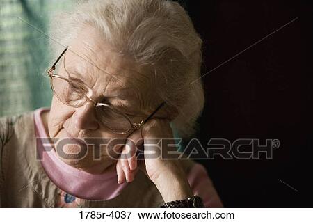 Stock Photo - Close-up of senior woman in contemplation. Fotosearch