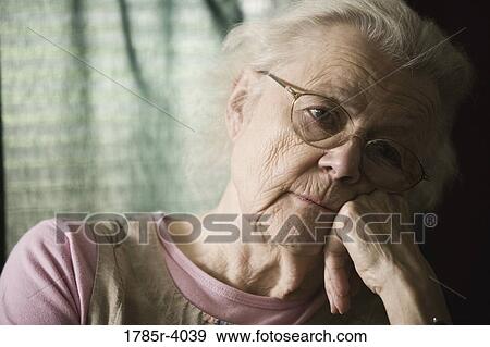 Stock Photo - Close-up of senior woman in contemplation. Fotosearch