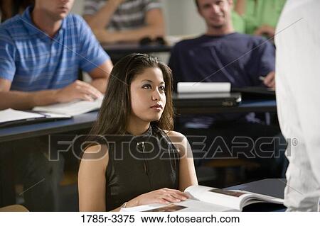 Close-up of students in a classroom View Large Photo Image Stock Photography - Close-up of students in a classroom. Fotosearch
