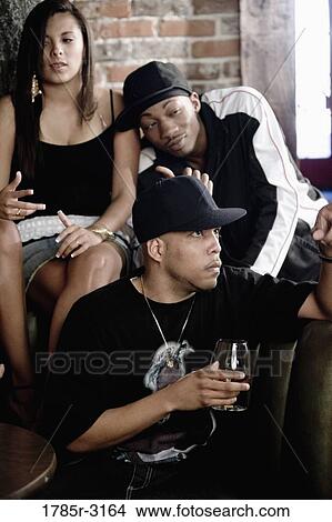 Close-up of three friends in hip-hop fashion View Large Photo Image Picture - Close-up of three friends in hip-hop fashion. Fotosearch