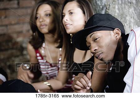 Close-up of three friends in hip-hop fashion View Large Photo Image Stock Photography - Close-up of three friends in hip-hop fashion. Fotosearch