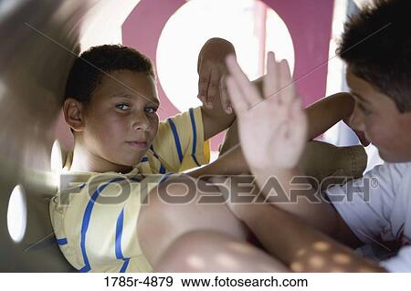 Close-up of two boys at the playground View Large Photo Image Stock Photo - Close-up of two boys at the playground. Fotosearch