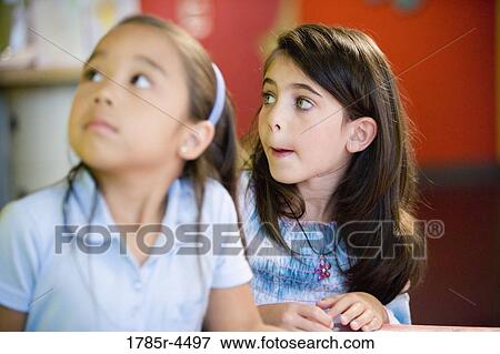 Close up of two little girls side by side View Large Photo Image Stock Photo - Close up of two little girls side by side. Fotosearch