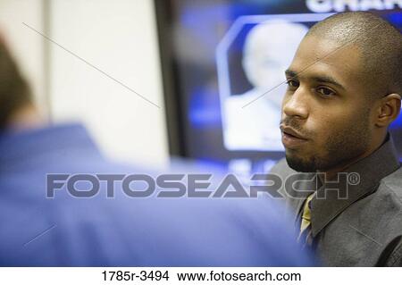 Close up of young man in office View Large Photo Image Picture - Close up of young man in office. Fotosearch