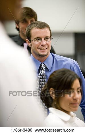Close up of young office workers View Large Photo Image Stock Image - Close up of young office workers. Fotosearch