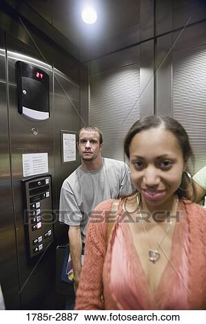 College students riding elevator View Large Photo Image Stock Photo - College students riding elevator. Fotosearch