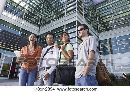 College students standing in front of a building View Large Photo Image Picture - College students standing in front of a building. Fotosearch