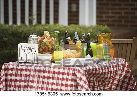 Drinks and snacks arranged on picnic table View Large Photo Image Stock Photography - Drinks and snacks arranged on picnic table. Fotosearch