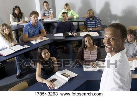 Elevated view of a teacher and students in the classroom View Large Photo Image Stock Image - Elevated view of a teacher and students in the classroom. Fotosearch