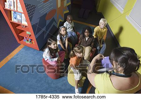 Elevated view of young children with teacher View Large Photo Image Stock Photography - Elevated view of young children with teacher. Fotosearch
