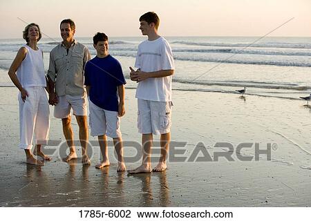 Stock Image - Family at the beach. Fotosearch