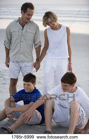 Stock Photo - Family at the beach. Fotosearch