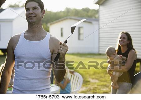 Family cookout in backyard View Large Photo Image Stock Image - Family cookout in backyard. Fotosearch