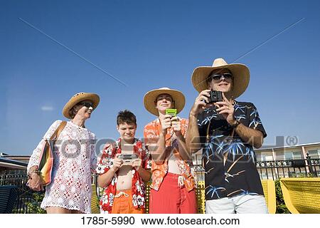 Family enjoying tropical vacation View Large Photo Image Stock Image - Family enjoying tropical vacation. Fotosearch