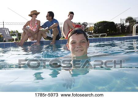 Family vacation at a swimming pool View Large Photo Image Stock Image - Family vacation at a swimming pool. Fotosearch