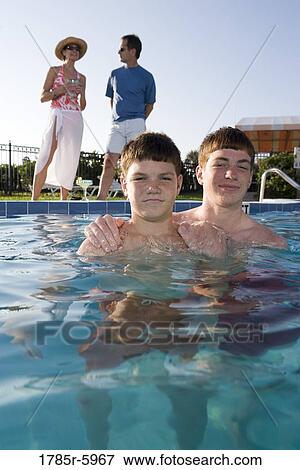 Family vacation at a swimming pool View Large Photo Image Stock Photo - Family vacation at a swimming pool. Fotosearch