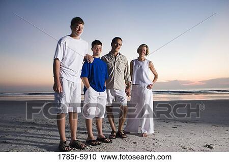Stock Image - Family vacation at the beach. Fotosearch