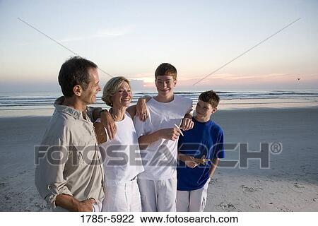 Family vacation at the beach View Large Photo Image Stock Image - Family vacation at the beach. Fotosearch