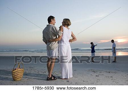Stock Image - Family vacation at the beach. Fotosearch