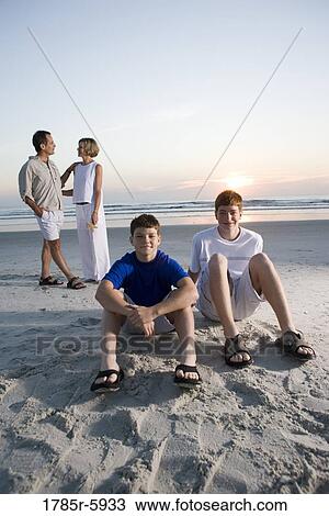 Stock Image - Family vacation at the beach. Fotosearch