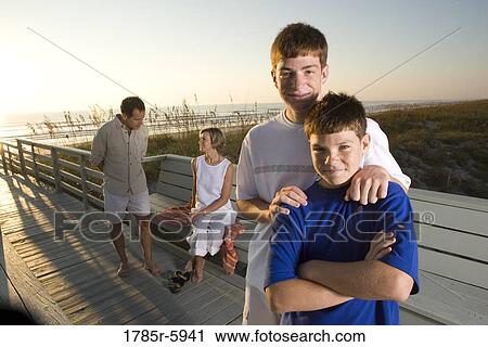 Stock Image - Family vacation at the beach. Fotosearch