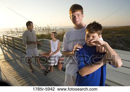 Stock Image - Family vacation at the beach. Fotosearch