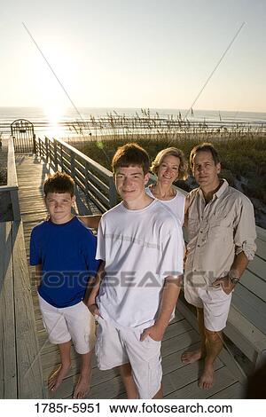 Stock Image - Family vacation at the beach. Fotosearch