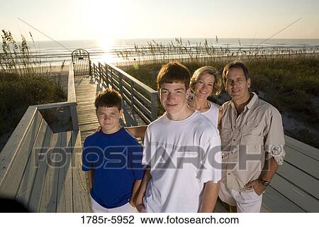 Stock Image - Family vacation at the beach. Fotosearch