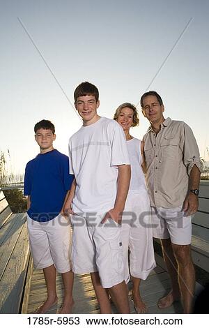 Stock Image - Family vacation at the beach. Fotosearch