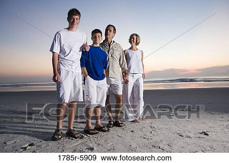 Stock Photo - Family vacation at the beach. Fotosearch