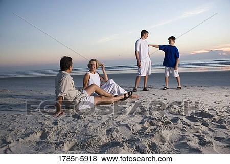 Stock Photo - Family vacation at the beach. Fotosearch