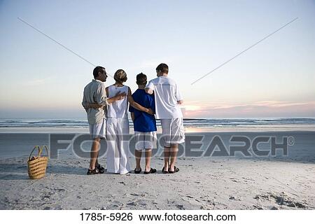 Stock Photograph - Family vacation at the beach. Fotosearch