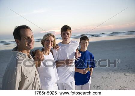 Stock Photography - Family vacation at the beach. Fotosearch